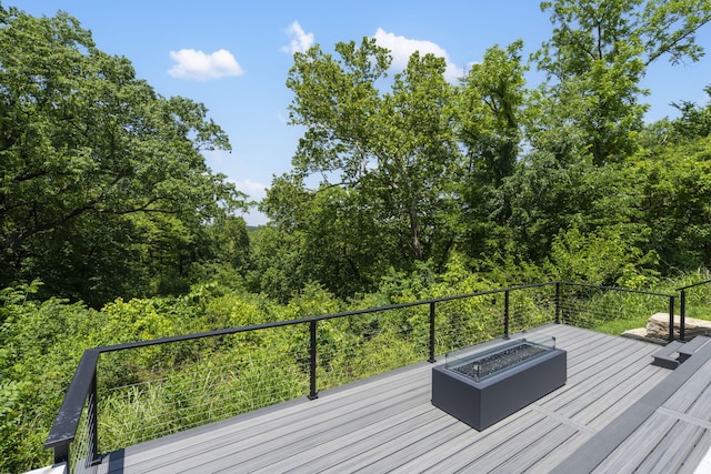 5817 E Summit View Dr, Springfield, MO 65809 - wooden deck with a fire pit