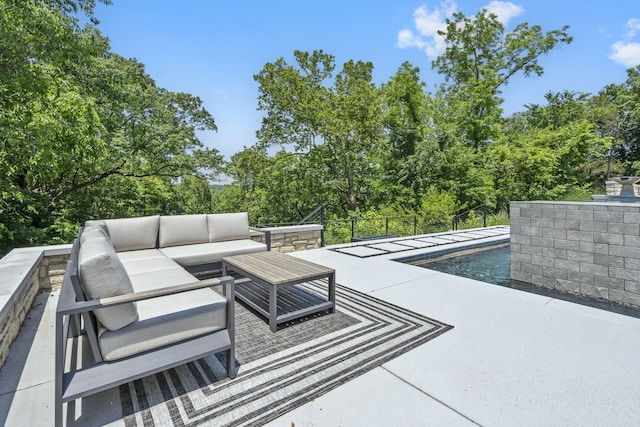 5817 E Summit View Dr, Springfield, MO 65809 - view of patio featuring an outdoor living space, an outdoor pool, and view of wooded area