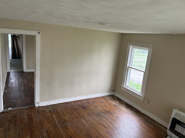 201 W Pennington Ave, Ava, MO 65608 - empty room featuring heating unit and hardwood / wood-style floors