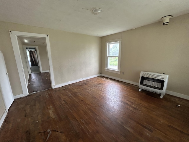 201 W Pennington Ave, Ava, MO 65608 - unfurnished living room with heating unit and hardwood / wood-style flooring