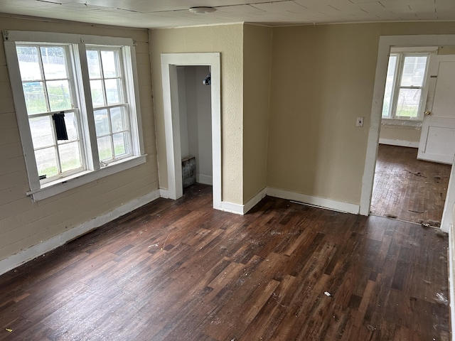 201 W Pennington Ave, Ava, MO 65608 - unfurnished room featuring dark wood-type flooring and healthy amount of natural light