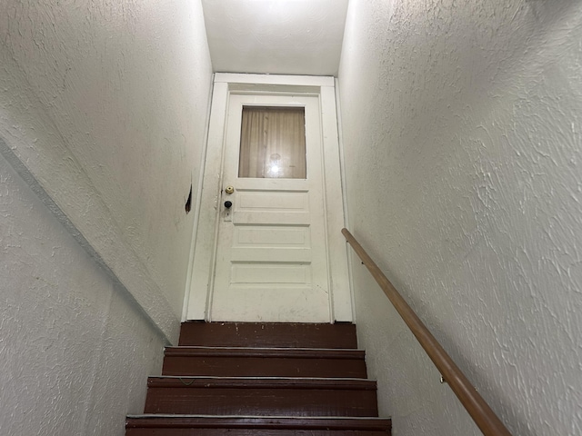 201 W Pennington Ave, Ava, MO 65608 - staircase with a textured wall