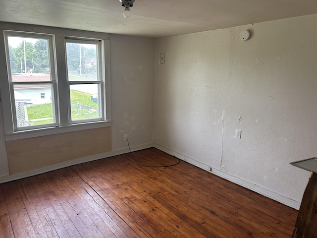 201 W Pennington Ave, Ava, MO 65608 - unfurnished room with hardwood / wood-style flooring, plenty of natural light, and a smoke detector