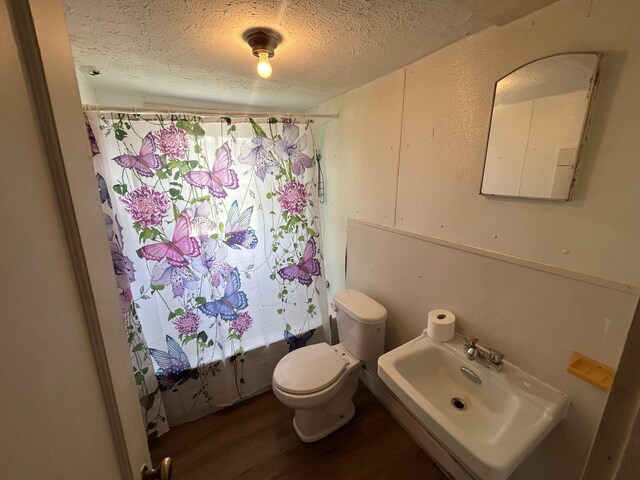 201 W Pennington Ave, Ava, MO 65608 - full bathroom with a textured ceiling and wood finished floors