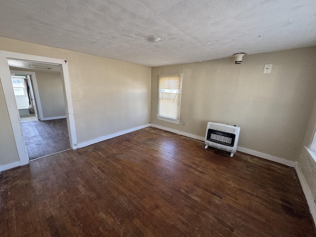 201 W Pennington Ave, Ava, MO 65608 - unfurnished living room featuring heating unit and wood finished floors