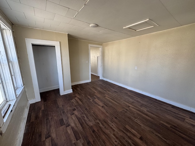 201 W Pennington Ave, Ava, MO 65608 - unfurnished bedroom with dark wood-type flooring and attic access