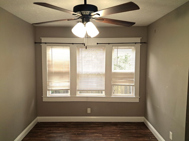 2412 W Olive St, Springfield, MO 65802 - empty room featuring dark wood finished floors, ceiling fan, and a textured ceiling
