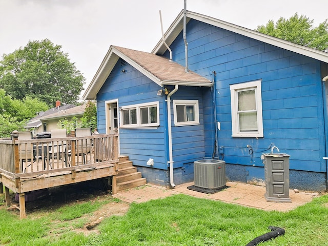 2412 W Olive St, Springfield, MO 65802 - rear view of property with a deck and a yard
