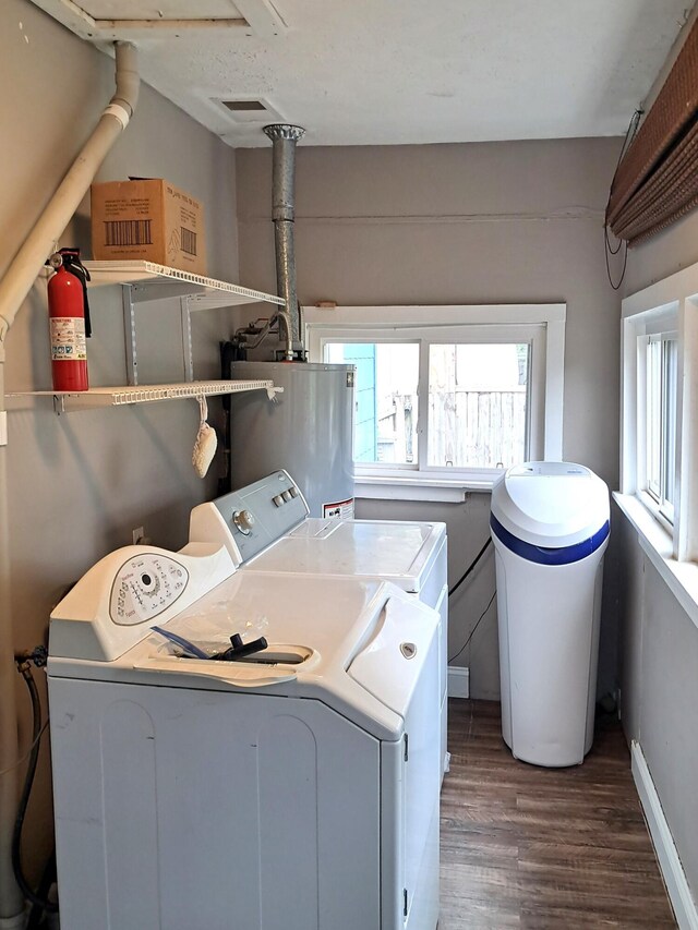 2412 W Olive St, Springfield, MO 65802 - laundry room with separate washer and dryer, water heater, wood finished floors, and healthy amount of natural light