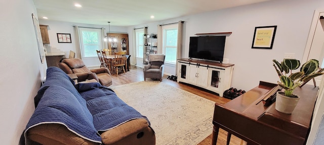 524 Niangua Rd, Niangua, MO 65713 - living area featuring wood finished floors, recessed lighting, and a chandelier