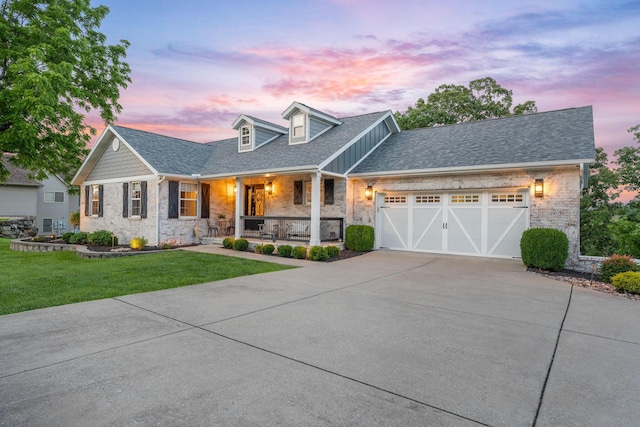 167 Jacks Hollow Rd, Walnut Shade, MO 65771 - new england style home with a porch, concrete driveway, a front yard, an attached garage, and a shingled roof