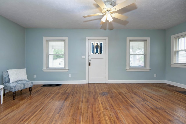 1612 N Grant Ave, Springfield, MO 65803 - entrance foyer with wood finished floors, ceiling fan, and a textured ceiling