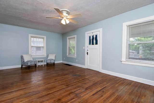 1612 N Grant Ave, Springfield, MO 65803 - unfurnished room with hardwood / wood-style floors, a ceiling fan, and a textured ceiling