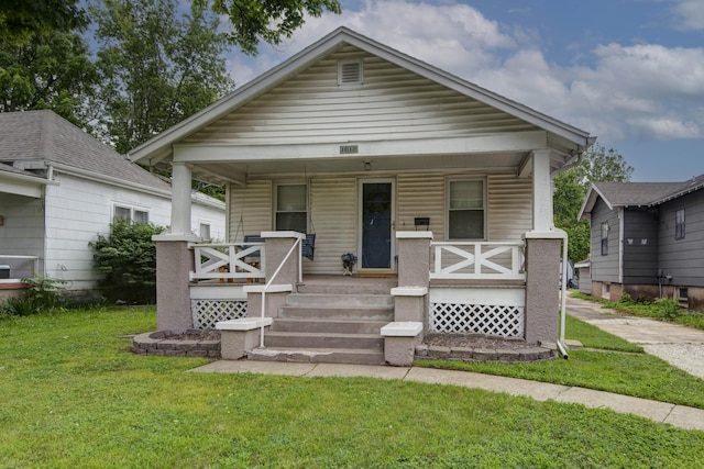 1612 N Grant Ave, Springfield, MO 65803 - view of front of house featuring covered porch and a front yard