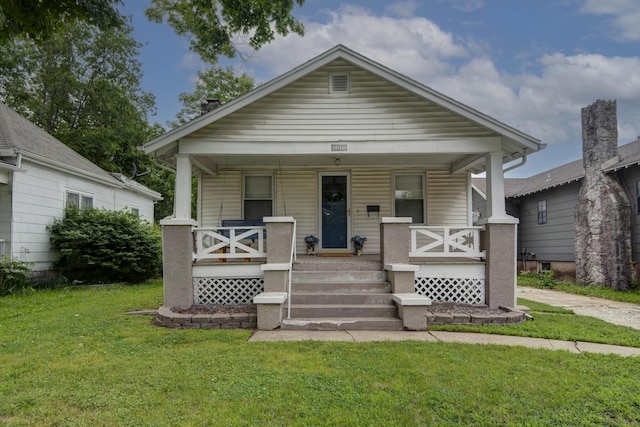 1612 N Grant Ave, Springfield, MO 65803 - view of front facade featuring covered porch and a front lawn