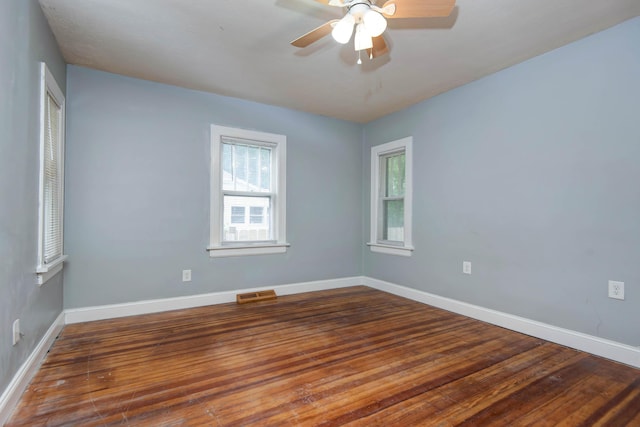 1612 N Grant Ave, Springfield, MO 65803 - spare room featuring wood finished floors and a ceiling fan