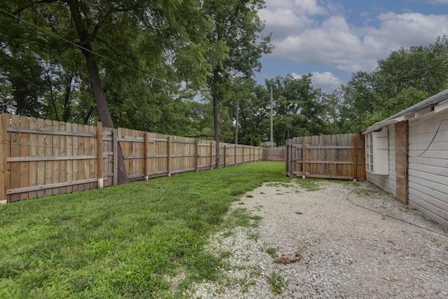 1612 N Grant Ave, Springfield, MO 65803 - fenced backyard with view of wooded area