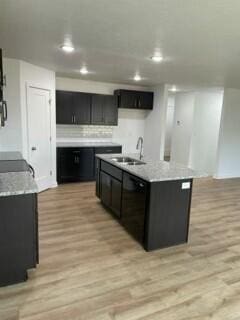 608 N Cheyenne Valley Rd, Nixa, MO 65714 - kitchen featuring black dishwasher, light wood-style flooring, light countertops, recessed lighting, and dark cabinets