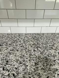 608 N Cheyenne Valley Rd, Nixa, MO 65714 - kitchen view of light stone counters and white cabinetry