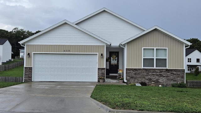 608 N Cheyenne Valley Rd, Nixa, MO 65714 - view of front of property with concrete driveway, an attached garage, board and batten siding, and stone siding