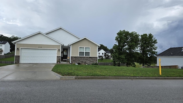 608 N Cheyenne Valley Rd, Nixa, MO 65714 - craftsman-style house with an attached garage, board and batten siding, concrete driveway, a front lawn, and stone siding