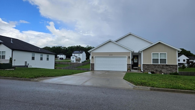 608 N Cheyenne Valley Rd, Nixa, MO 65714 - view of front of house with an attached garage, driveway, board and batten siding, and stone siding