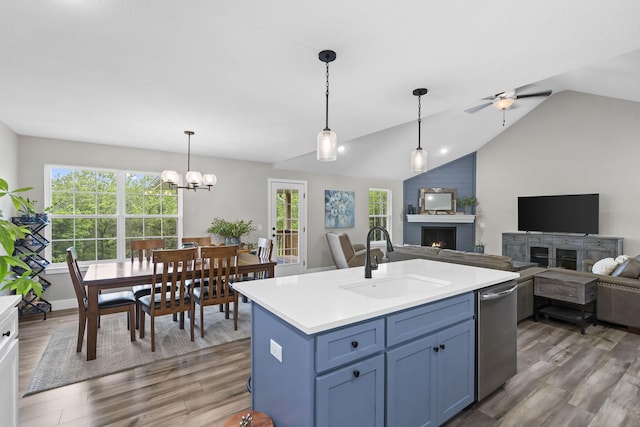 427 N Maynard Rd, Nixa, MO 65714 - kitchen with open floor plan, wood finished floors, dishwasher, and lofted ceiling