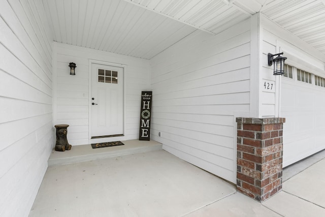 427 N Maynard Rd, Nixa, MO 65714 - view of exterior entry with a garage