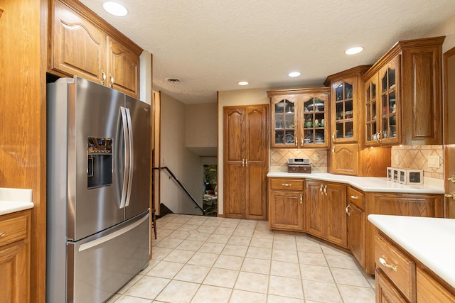 2620 Big Timber Rd, Marshfield, MO 65706 - kitchen featuring stainless steel refrigerator with ice dispenser, brown cabinetry, backsplash, and recessed lighting