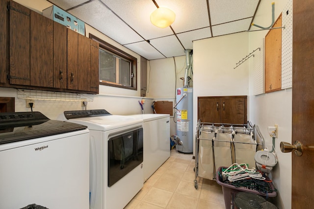 2620 Big Timber Rd, Marshfield, MO 65706 - washroom featuring washing machine and dryer, water heater, cabinet space, and light tile patterned flooring