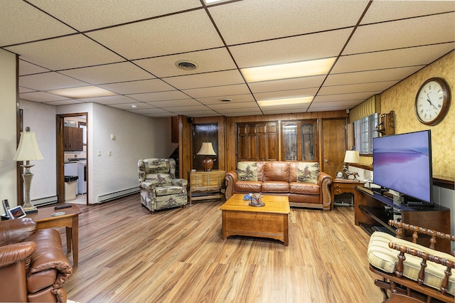 2620 Big Timber Rd, Marshfield, MO 65706 - living area with a drop ceiling, light wood-style floors, baseboard heating, and a baseboard heating unit