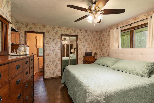 2620 Big Timber Rd, Marshfield, MO 65706 - bedroom featuring wallpapered walls, dark wood finished floors, a textured ceiling, and ceiling fan