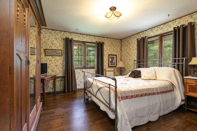 2620 Big Timber Rd, Marshfield, MO 65706 - bedroom featuring wallpapered walls, dark wood finished floors, and a textured ceiling