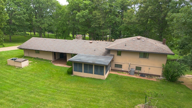 2620 Big Timber Rd, Marshfield, MO 65706 - rear view of property with a sunroom, a chimney, a lawn, and a shingled roof