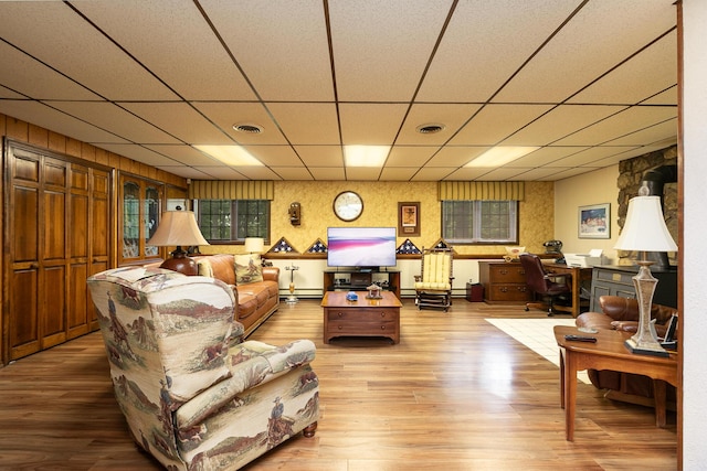 2620 Big Timber Rd, Marshfield, MO 65706 - living room featuring an office area, a drop ceiling, wood finished floors, and a baseboard radiator