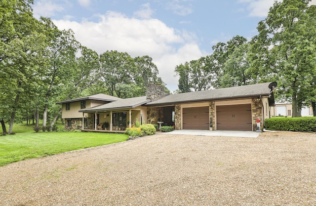 2620 Big Timber Rd, Marshfield, MO 65706 - split level home featuring stone siding, driveway, an attached garage, a front yard, and a chimney