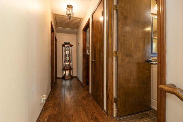 2620 Big Timber Rd, Marshfield, MO 65706 - hallway featuring dark wood-type flooring and baseboards