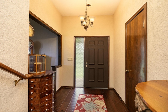 2620 Big Timber Rd, Marshfield, MO 65706 - foyer with a chandelier, dark wood-style flooring, and a textured wall