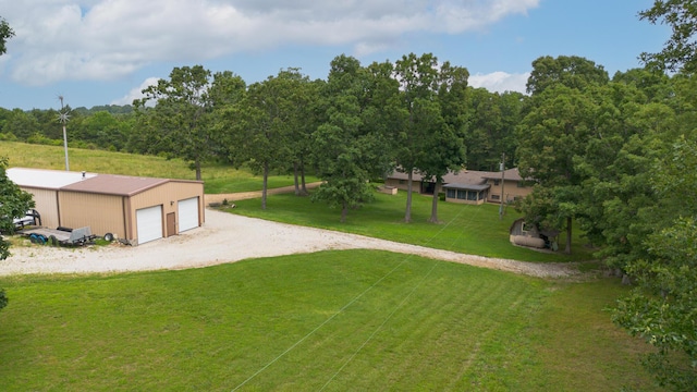 2620 Big Timber Rd, Marshfield, MO 65706 - view of green lawn featuring an outdoor structure and a detached garage