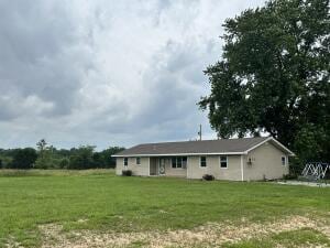 211 Sheridan Rd, Fair Grove, MO 65648 - back of property featuring a lawn