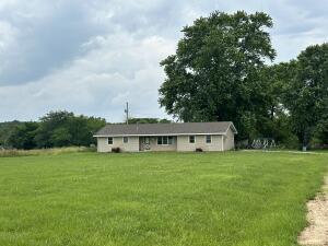 211 Sheridan Rd, Fair Grove, MO 65648 - back of property featuring a lawn