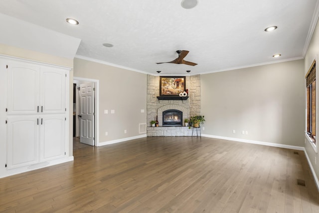 903 E Elizabeth St, Republic, MO 65738 - unfurnished living room featuring a ceiling fan, a fireplace, wood finished floors, recessed lighting, and crown molding