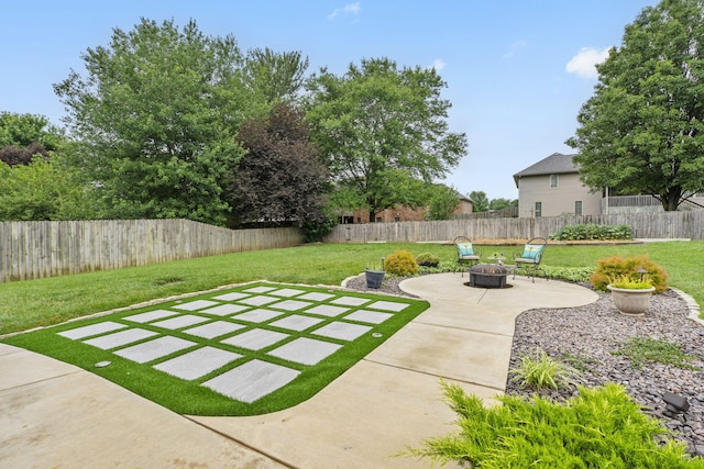 903 E Elizabeth St, Republic, MO 65738 - fenced backyard featuring an outdoor fire pit and a patio area