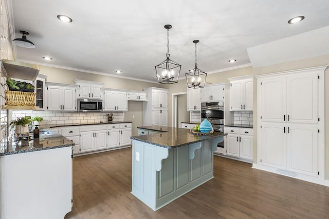 903 E Elizabeth St, Republic, MO 65738 - kitchen featuring stainless steel appliances, backsplash, white cabinets, ornamental molding, and recessed lighting