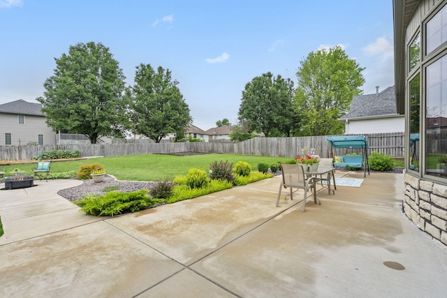 903 E Elizabeth St, Republic, MO 65738 - fenced backyard featuring a fire pit, a patio area, and outdoor dining space