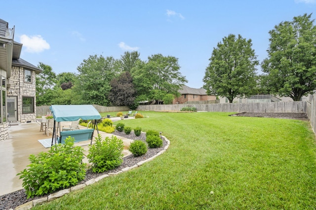 903 E Elizabeth St, Republic, MO 65738 - fenced backyard featuring a patio area