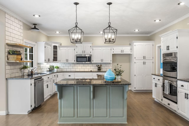 903 E Elizabeth St, Republic, MO 65738 - kitchen with appliances with stainless steel finishes, open shelves, white cabinets, decorative backsplash, and recessed lighting