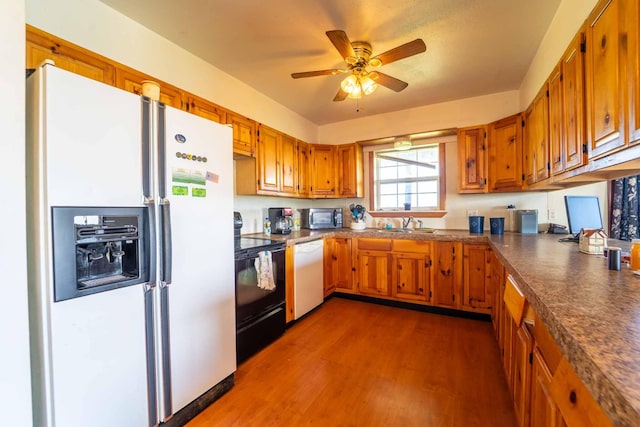 15608 Lawrence Unit 2007, Miller, MO 65707 - kitchen with white appliances, brown cabinets, and ceiling fan