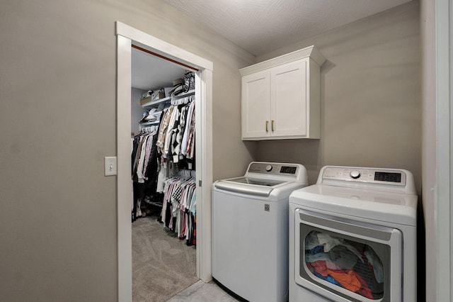 926 E Downshire Dr, Nixa, MO 65714 - washroom featuring washer and clothes dryer, cabinet space, and light colored carpet