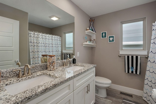 926 E Downshire Dr, Nixa, MO 65714 - bathroom with wood finished floors, double vanity, plenty of natural light, and a shower with curtain